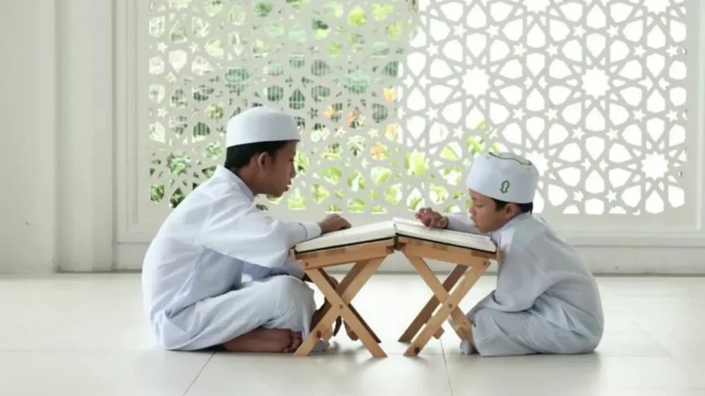Two brothers reading the Quran together at home